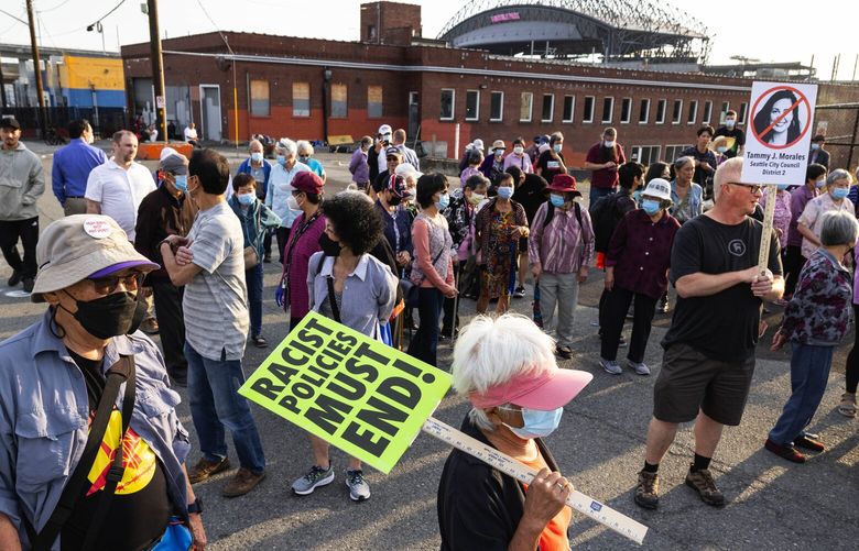 The CID community marched to the spot of a proposed expansion of homeless services Thursday. 221483