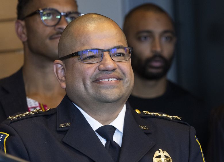 Former Interim Police Chief Adrian Diaz is all smiles as Seattle Mayor Bruce Harrell introduces him as Seattle’s new police chief at a press conference held at City Hall Tuesday.  (Ellen M. Banner / The Seattle Times)