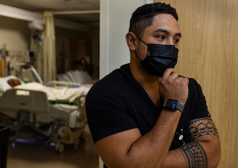 Kevin Saavedra, a Harborview travel nurse, works his night shift, Wednesday in Seattle. (Ken Lambert / The Seattle Times)