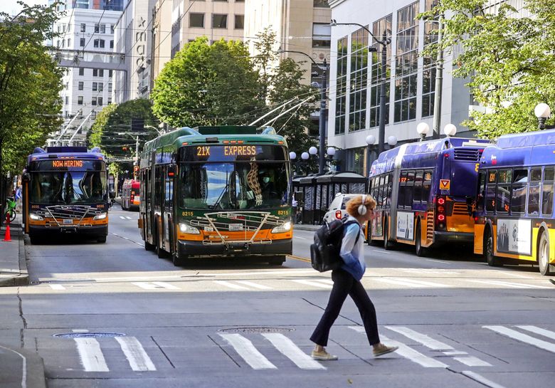 The Seattle City Council is endorsing plans to change how Third Avenue currently works as a transit corridor. The concern now is that the “wall of buses,” without anything else to attract people to Third, creates an environment where unwanted activity thrives. (Greg Gilbert / The Seattle Times)