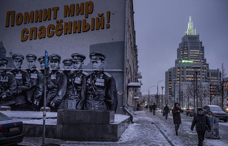 FILE – A patriotic mural in Moscow on Dec. 13, 2021, showing Soviet pilots from World War II, based on a photograph of the Victory Parade in 1945. As Vladimir Putin’s “special military operation” enters a new chapter, Russians are being plucked from villages around the country for training and military service. (Sergey Ponomarev/The New York Times) XNYT175 XNYT175