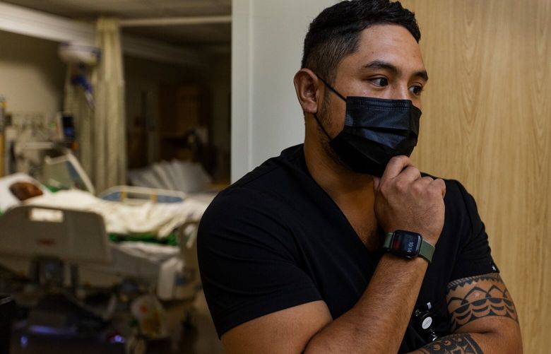 Kevin Saavedra, a Harborview travel nurse, works his nightshift, Wednesday, Sept. 21, 2022 in Seattle.