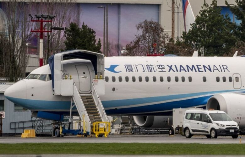 A Boeing Co. 737 Max airplane, destined for XiamenAir, outside the company’s manufacturing facility in Renton, Washington, U.S., on Monday, March 21, 2022. China Eastern Airlines will ground all of its Boeing 737-800 jets starting Tuesday after a plane crash in the southwestern Chinese region of Guangxi. Photographer: David Ryder/Bloomberg