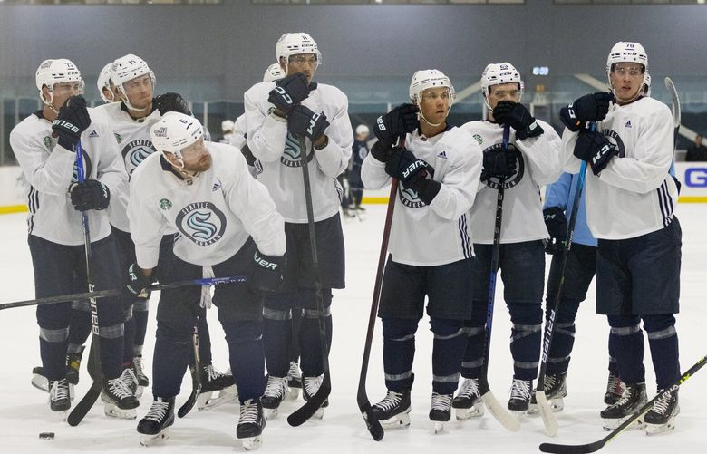 Seattle Kraken ice hockey players listen to coaches during the first day of training camp at the Kraken Community Iceplex in Seattle, WA on September 22, 2022. 221587
