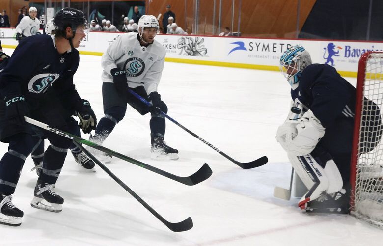 Seattle Kraken players take a shot on a goal guarded by Martin Jones during the first day of training camp at the Kraken Community Iceplex in Seattle, WA on September 22, 2022. 221587