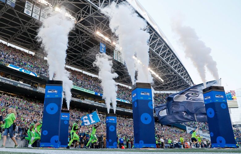 The Seattle Seahawks run out of the tunnel before the start of the game Monday, Sept. 12, 2022, in Seattle. 221558