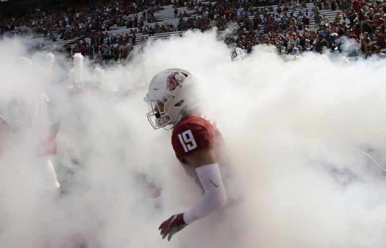 Washington State wide receiver Reed Shumpert (19) and his teammates run onto the field before an NCAA college football game against Colorado State, Saturday, Sept. 17, 2022, in Pullman, Wash. (AP Photo/Young Kwak) OTK OTK