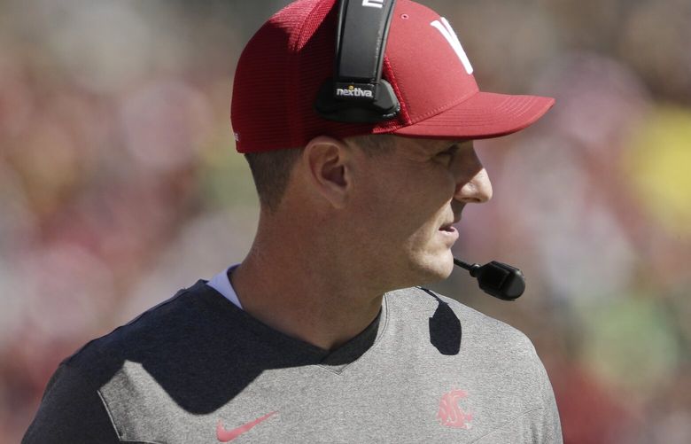 Washington State head coach Jake Dickert watches the first half of an NCAA college football game against Oregon, Saturday, Sept. 24, 2022, in Pullman, Wash. (AP Photo/Young Kwak) WAYK110 WAYK110