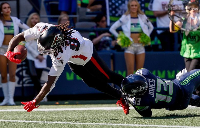 Atlanta Falcons running back Cordarrelle Patterson dives past Seattle Seahawks safety Josh Jones for a 17-yard touchdown during the second quarter, Sunday, Sept. 25, 2022, in Seattle. 221653