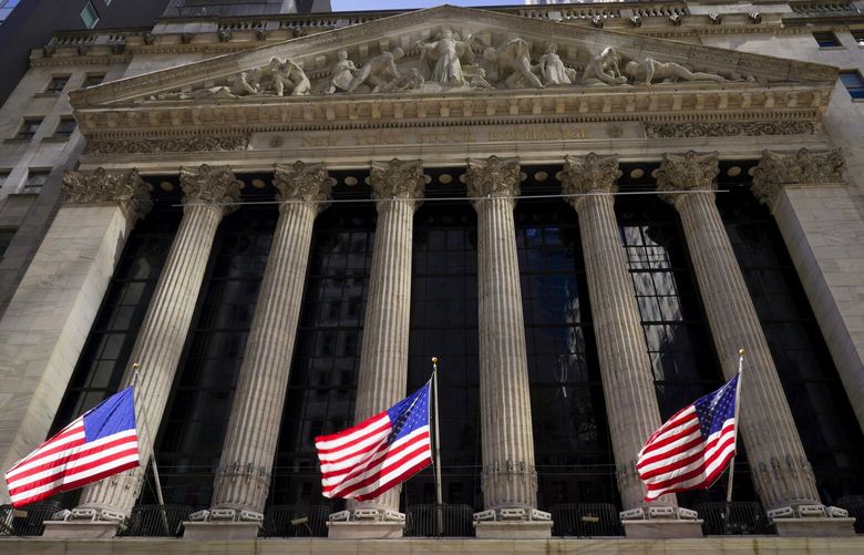 American flags fly outside the New York Stock Exchange, Friday, Sept. 23, 2022, in New York. Stocks tumbled worldwide Friday on more signs the global economy is weakening, just as central banks raise the pressure even more with additional interest rate hikes. (AP Photo/Mary Altaffer) NYMA101
