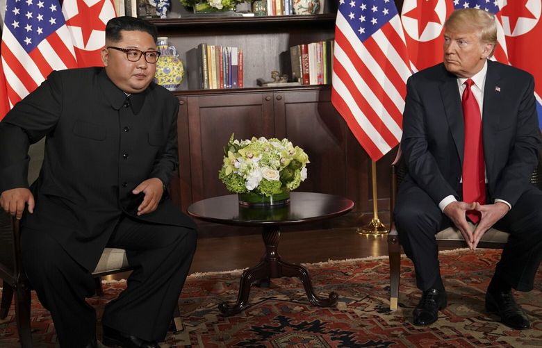 **EMBARGO: No electronic distribution, Web posting or street sales before MONDAY 6:00 a.m. ET NOV. 12, 2018. No exceptions for any reasons. EMBARGO set by source.** FILE — North Korean leader Kim Jong Un and President Donald Trump during their summit meeting in Singapore, June 12, 2018. Trump says the nuclear threat from North Korea is over, but new satellite images of undeclared missile bases suggest that it has worsened since his Singapore summit. (Doug Mills/The New York Times)