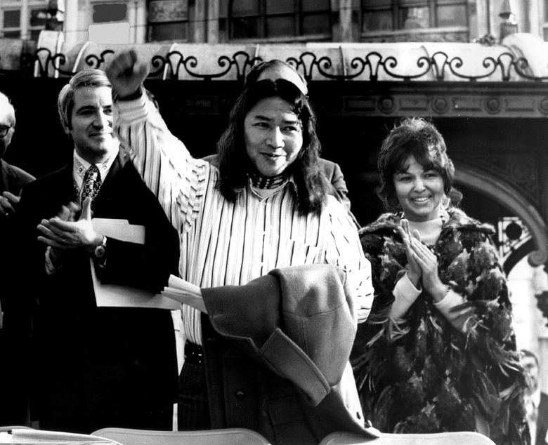 March 17, 1972: &#8220;Bernie Whitebear gave a clenched-fist salute in front of the pergola in Pioneer Square yesterday after the document-signing ceremony. He was flanked by Mayor Wes Uhlman and Joyce Reyes.&#8221; Reyes was president of the American Indian Women&#8217;s Service League. (George Carkonen / The Seattle Times)