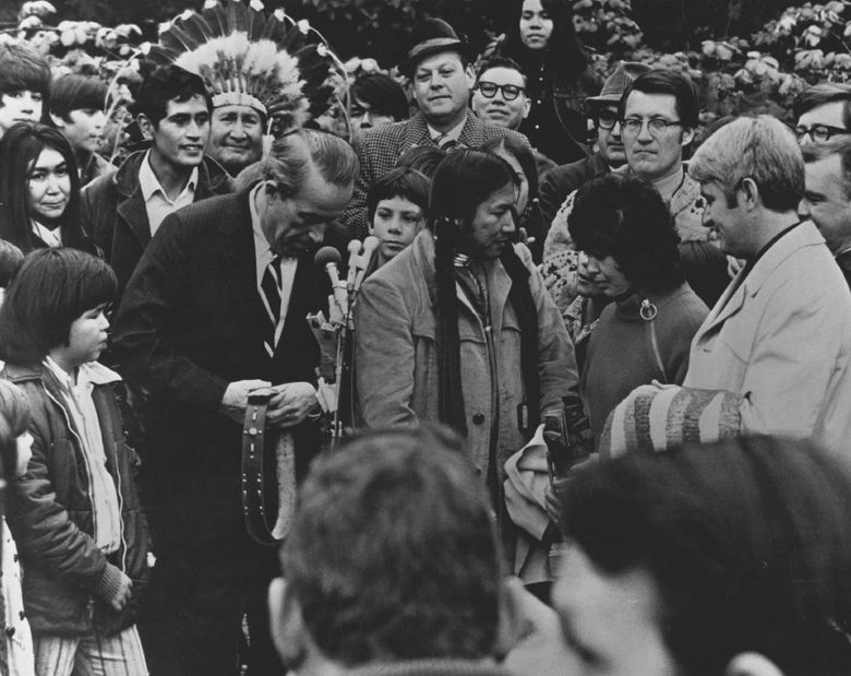 Nov. 15, 1971: &#8220;Indians and city make their peace &#8212; Indians and government officials shared the spotlight yesterday at Fort Lawton during the announcement that an agreement had been reached under which the United Indians of All Tribes would lease 16 acres at the fort from the city to be developed as an Indian cultural center. In the foreground, from left, were Senator Henry M. Jackson, who sponsored legislation which permitted the city to acquire much of the fort for a park; Bernie Whitebear, president of the Indian organization; Joyce Reyes, of the American Indian Women&#8217;s League, and Mayor Wes Uhlman.&#8221; (Peter Liddell / The Seattle Times)