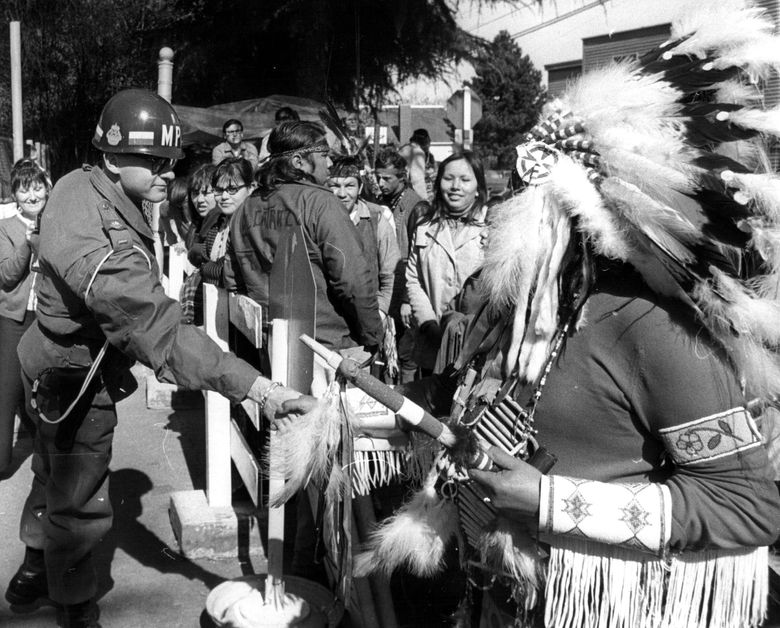 March 19, 1970: &#8220;MPs meet Indians &#8212; Indian Chief Frank (White Buffalo) Mann, a Hunkpapa Sioux Indian, shakes hands with a Ft. Lawton MP Wednesday after the chief performed a sacred prayer to protect the Indian demonstrators that claim the fort. Indians have been demanding Ft. Lawton be used as an Indian cultural and educational center.&#8221; (The Associated Press)