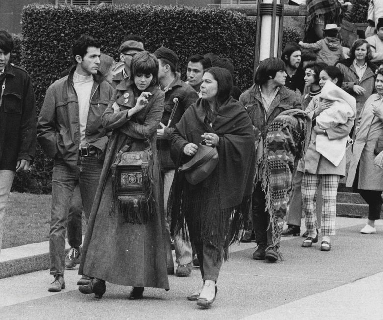 March 16, 1970: &#8220;Jane Fonda wore a suede maxi-coat as she talked with Janet McCloud, Indian activist, on her left, as they walked outside the United States Courthouse this afternoon. Miss Fonda and Mark Lane, an attorney, said they were filing a lawsuit challenging an order banning them from four Washington military bases. &#8221; (Dick Heyza / The Seattle Times)