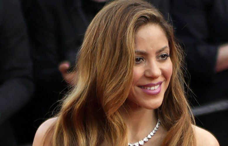 FILE – Shakira poses for photographers upon arrival at the premiere of the film ‘Elvis’ at the 75th international film festival, Cannes, southern France, Wednesday, May 25, 2022. A Spanish judge on Tuesday, Sept. 27, 2022 approved a trial for Colombian pop singer Shakira on charges of tax fraud. Spanish prosecutors accused the entertainer in 2018 of failing to pay 14.5 million euros ($13.9) in taxes on income earned between 2012 and 2014. (AP Photo/Daniel Cole, file) LBL102 LBL102