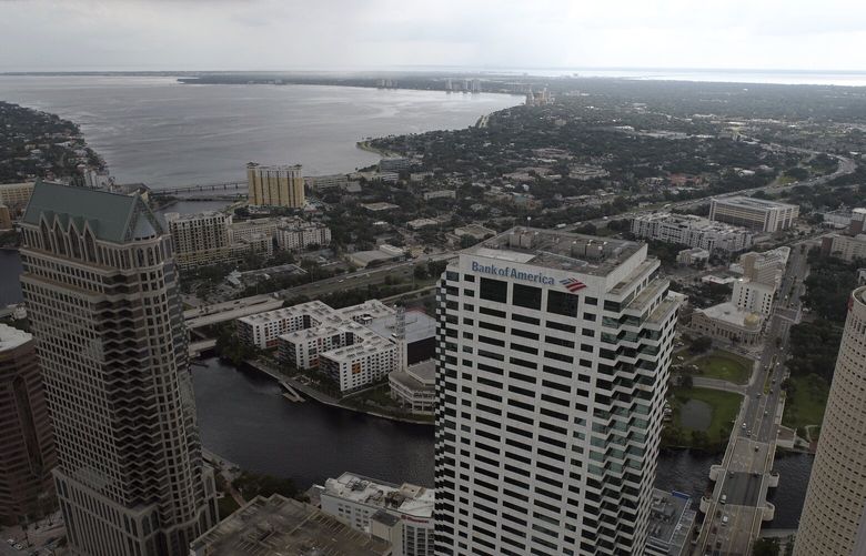 In this aerial image, the city of Tampa, Fla., is seen Monday, Sept. 26, 2022. Hurricane Ian was growing stronger as it barreled toward Cuba on a track to hit Florida’s west coast as a major hurricane as early as Wednesday. It’s been more than a century since a major storm like Ian has struck the Tampa Bay area, which blossomed from a few hundred thousand people in 1921 to more than 3 million today. (DroneBase via AP) GAMS603 GAMS603