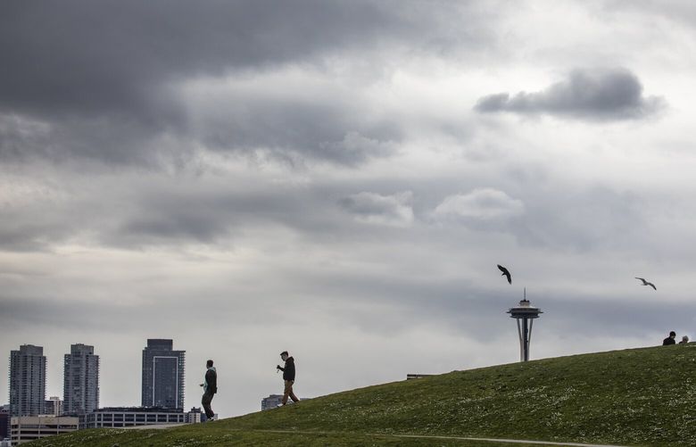 Intense cloud patterns form a backdrop to Gas Works Park, Sunday, March 13, 2022 in Seattle. Forecasters say a mild atmospheric river or a “good frontal system” are expected to reach the Puget Sound region sometime Monday and last through midweek. 219847