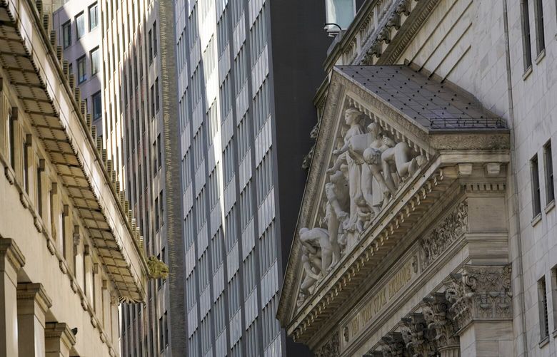 The New York Stock Exchange building, right, is seen, Tuesday, Sept. 27, 2022, in the Financial District of New York. (AP Photo/Mary Altaffer) 