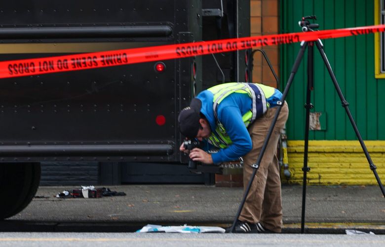 Seattle Police investigate the scene where a pedestrian was hit and killed along 1st Avenue South in the Sodo neighborhood of Seattle Wednesday September 28, 2022. 221719