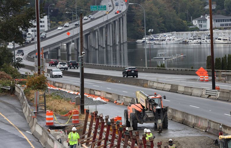 Construction crews work on SR 520 in Seattle, WA on September 28, 2022. Beginning Friday night, both directions of SR 520 will close between I-5 in Seattle and 92nd Ave NE in Clyde Hill and all associated on and off ramps. 221710