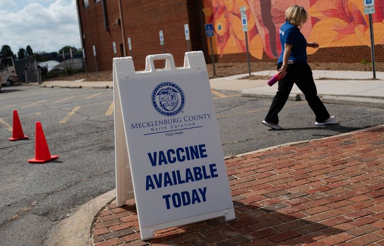 A public health worker enters the building where people will be receiving monkeypox vaccines last month in Charlotte, N.C. MUST CREDIT: Photo for The Washington Post by Logan Cyrus