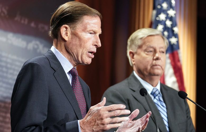 Sen. Lindsey Graham, R-S.C., right, listens as Sen. Richard Blumenthal, D-Conn., speaks during a news conference about refusing Russian annexation of any portion of Ukraine, Thursday, Sept. 29, 2022, on Capitol Hill in Washington. (AP Photo/Mariam Zuhaib) DCMZ506 DCMZ506