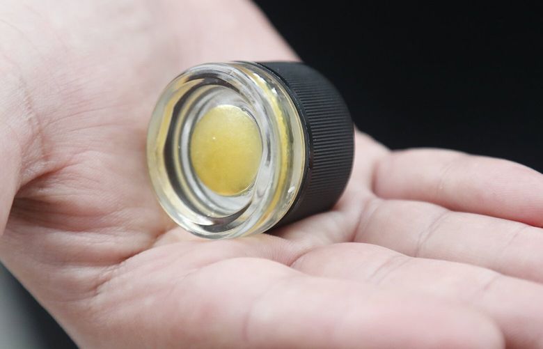 Ramsey Doudar, fulfillment lead at The Reef and leads a consumer advocacy group called Patients for Reasonable Cannabis Policy, holds a small jar of dabs-a high potency cannabis product.
Wednesday, September 28, 2022. 221706