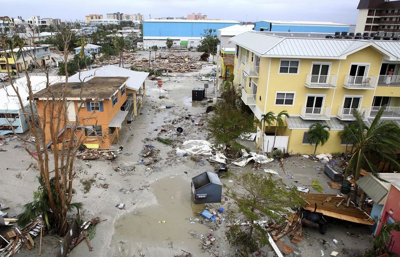 Damaged homes and businesses are seen in Fort Myers Beach, Fla., on Thursday, Sep 29, 2022, following Hurricane Ian. (Douglas R. Clifford/Tampa Bay Times via AP) FLPET404 FLPET404