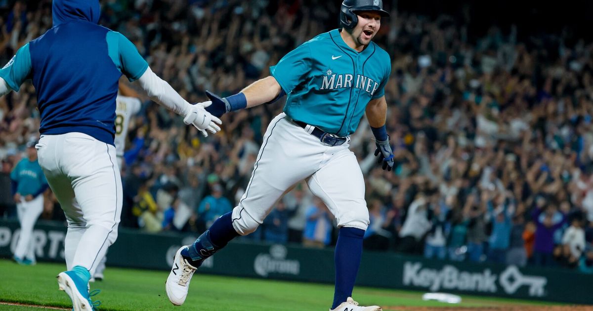 A Seattle Mariners fan wearing a Cal Raleigh jersey with Raleigh's  nickname, Big Dumper, enters T-Mobile Park before an opening day baseball  game between the Seattle Mariners and the Cleveland Guardians Thursday