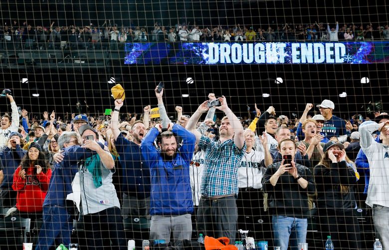 Fans celebrate the Seattle Mariners 2-1 win over the Oakland Athletics and the first post season in 21 years. 221659