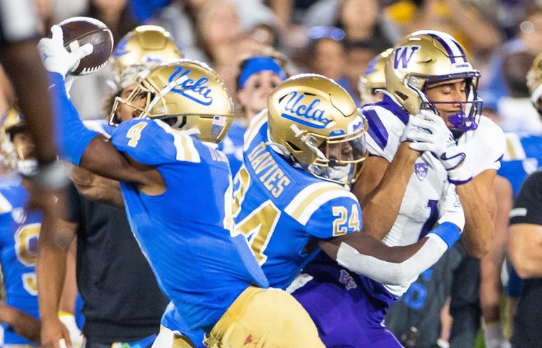 UCLA defensive back Stephan Blaylock steps in front of the Michael Penix pass for a second quarter interception. 221712