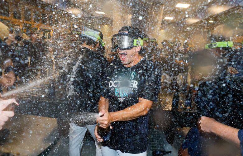 Seattle Mariners starting pitcher Marco Gonzales celebrates in the locker room after a 2-1 win over the Oakland Athletics and their first post season in 21 years. 221659