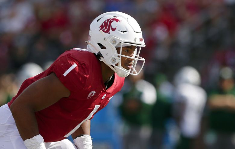 Washington State linebacker Daiyan Henley stands on the field during the  second half of an NCAA college football game against Utah, Thursday, Oct.  27, 2022, in Pullman, Wash. (AP Photo/Young Kwak Stock