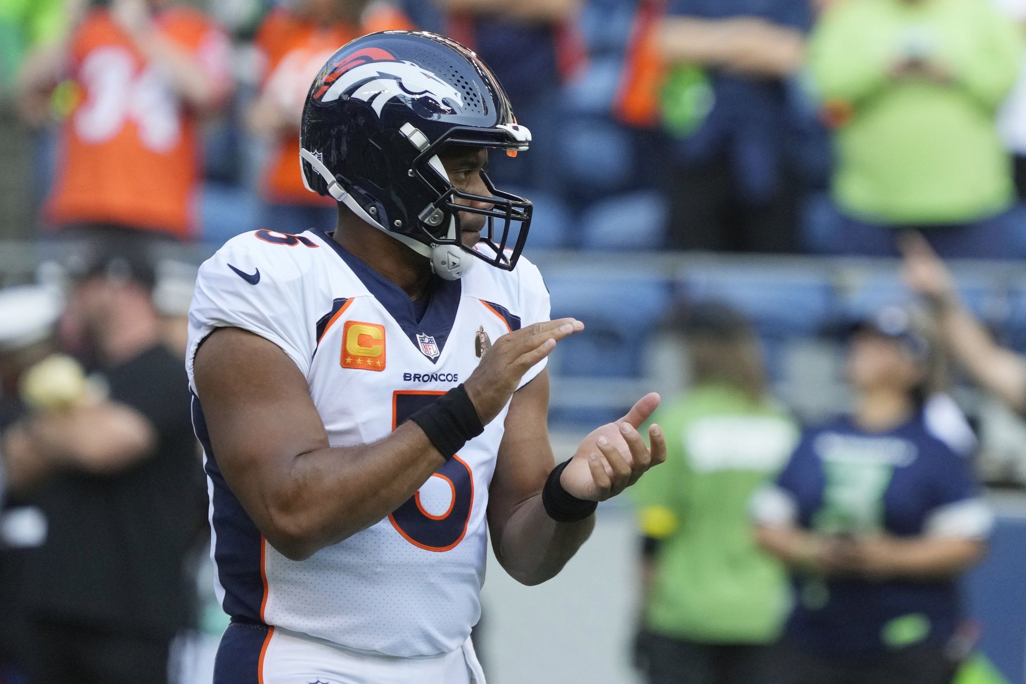 Broncos Russell Wilson greets some Seahawks, 1st fans in boo