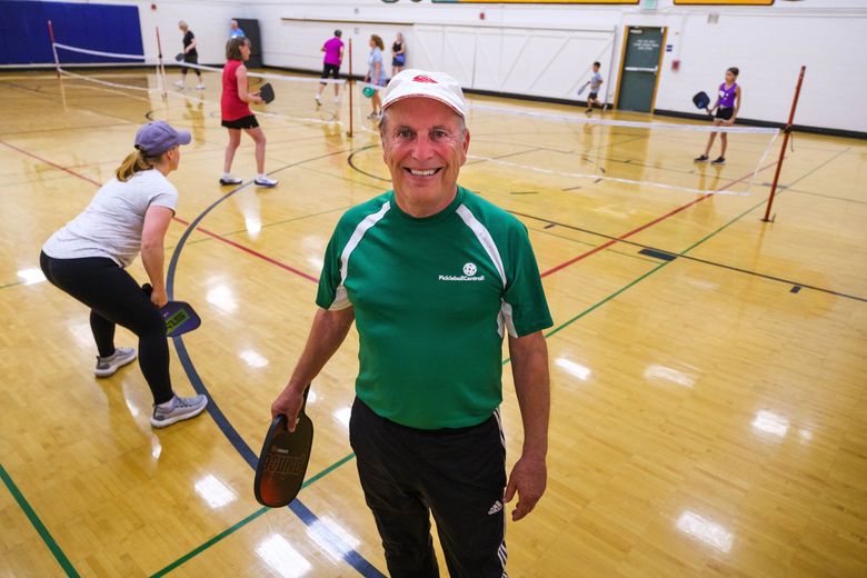 Roger BelAir teaches pickleball to a class in Edmonds in July. (Dean Rutz / The Seattle Times)