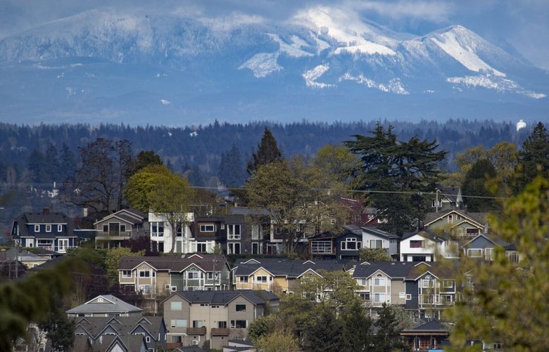 Homes are seen between Seattle’s Central District and Judkins Park neighborhoods, Sunday, April 10, 2022, as viewed looking east from north Beacon Hill. 220091