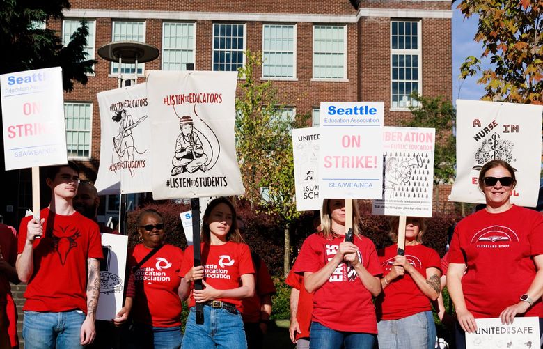 Educators, staff and supporters gather in front of Cleveland High School during the Seattle Education Association teacher’s strike in Seattle Wednesday, Sept. 7, 2022. 221515