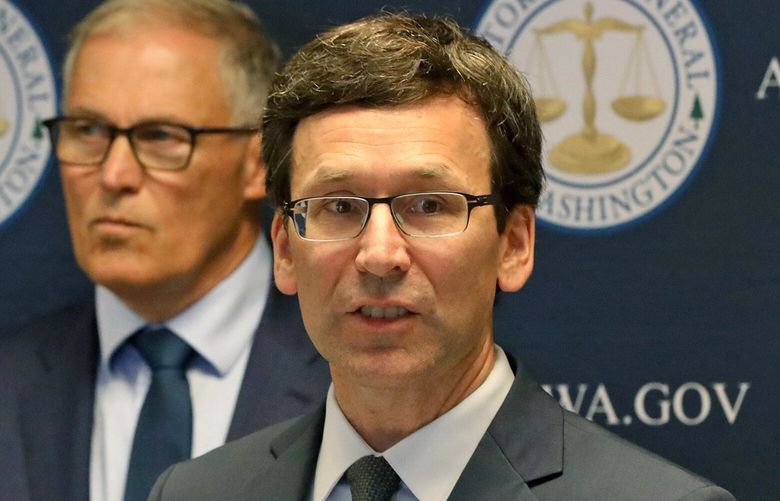 Washington state Attorney General Bob Ferguson announces a lawsuit challenging Trump’s use of Washington military project funding to pay for border wall on Thursday. At left is Gov. Jay Inslee.
September 19, 2019