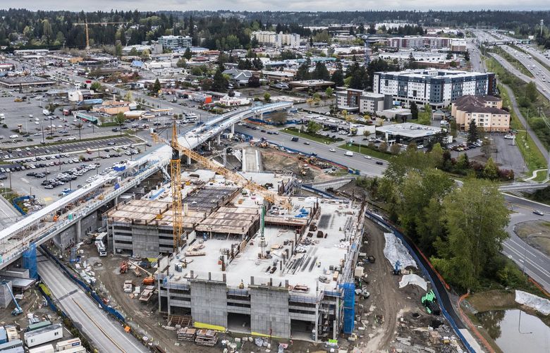 Tuesday, May 3, 2022.     Looking across the light-rail station under construcion along 44th Ave. W. and downtown Lynnwood.  Story about light-rail opening in 2024 along with thousands of apartments on their way.   220270