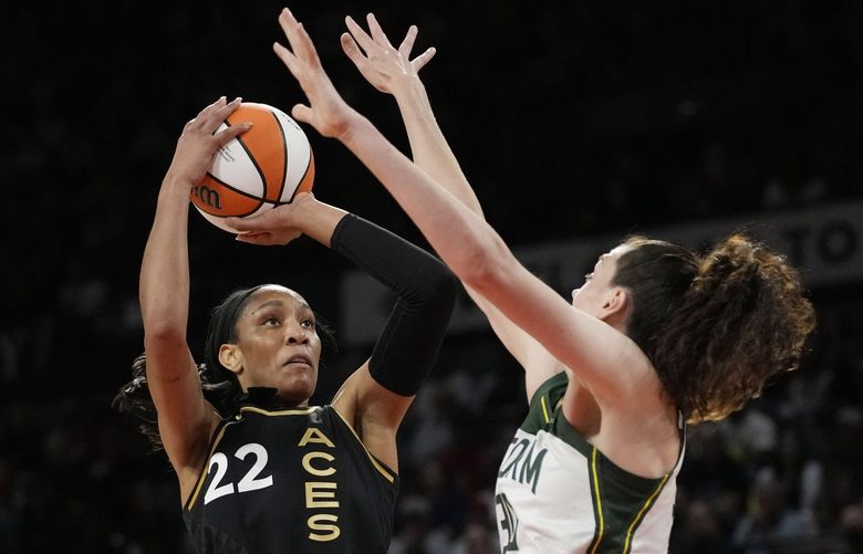Las Vegas Aces forward A’ja Wilson (22) shoots over Seattle Storm forward Breanna Stewart (30) during the first half in Game 2 of a WNBA basketball semifinal playoff series Wednesday, Aug. 31, 2022, in Las Vegas. (AP Photo/John Locher) NVJL117 NVJL117