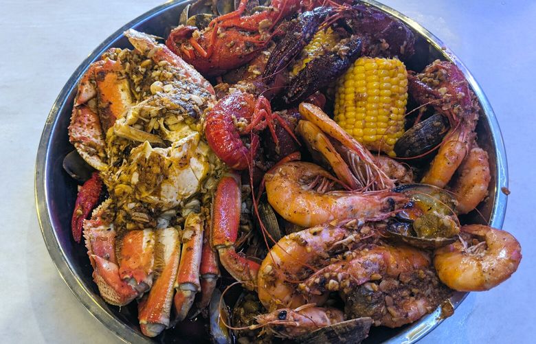 The seafood boil combo at Shoreline’s Bag O’ Crab features a full Dungeness crab, shrimp, crawfish, clams, corn and sausage for a messy, but satisfying meal.