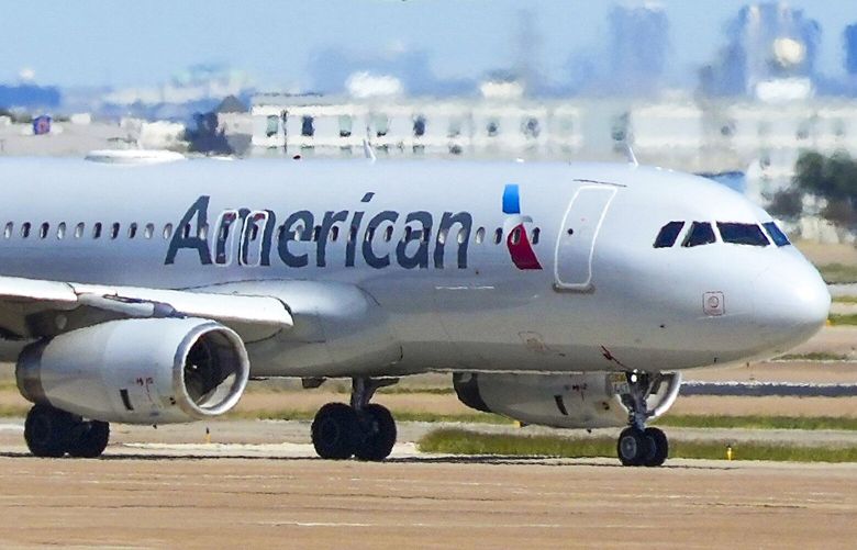 An American Airlines planes takes off as another taxis toward Terminal C at DFW Airport on Saturday, Oct. 16, 2021. (Smiley N. Pool/The Dallas Morning News) 31124541P