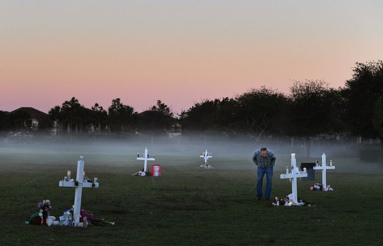 Steve Zipper visits a makeshift memorial in Pine Trails Park for the victims of the Marjory Stoneman Douglas High School shooting victims on Feb. 17, 2018, in Parkland, Fla. MUST CREDIT: Washington Post photo by Matt McClain