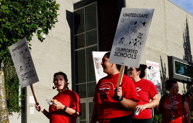 Educators, staff and supporters walk the picket line in front of Cleveland High School during the Seattle Education Association teacher’s strike in Seattle Wednesday, Sept. 7, 2022. 221515