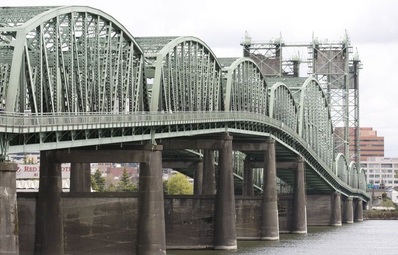 In this photo taken Wednesday April 27, 2011, the Interstate 5 bridge over the Columbia River is shown in Portland, Ore. Legislatures in Washington and Oregon aren’t expected to consider raising taxes this year to help pay for the $3.5 billion cost of replacing the bridge. But either or both could raise taxes as early as 2012. (AP Photo/Rick Bowmer)