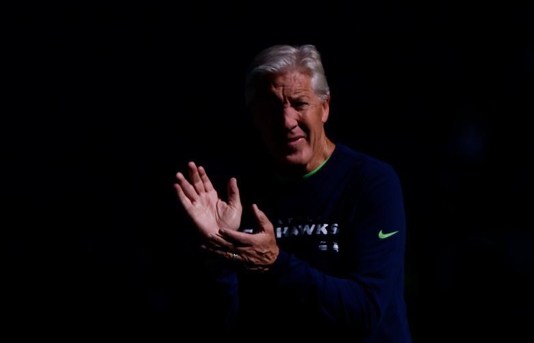 Seattle Seahawks head coach Pete Carroll claps during warm-ups before the start of a game against the Atlanta Falcons, Sunday, Sept. 25, 2022, in Seattle. 221653