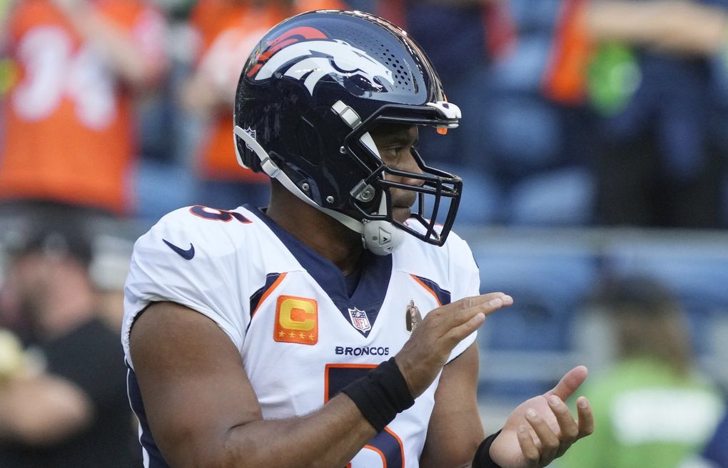 Broncos Russell Wilson greets some Seahawks, 1st fans in boo