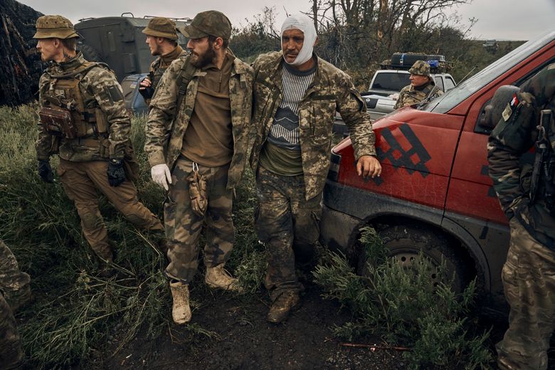 Ukrainian soldiers burn Russian flag as they reclaim territory