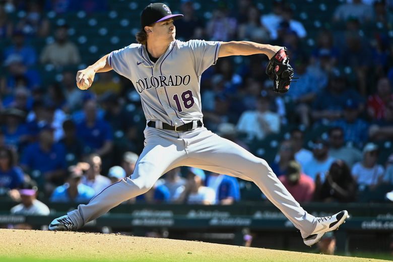 Joe, Grichuk lead Rockies over Cubs 4-3 for rare road win